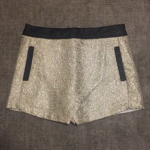 Metallic gold skort with faux leather trim